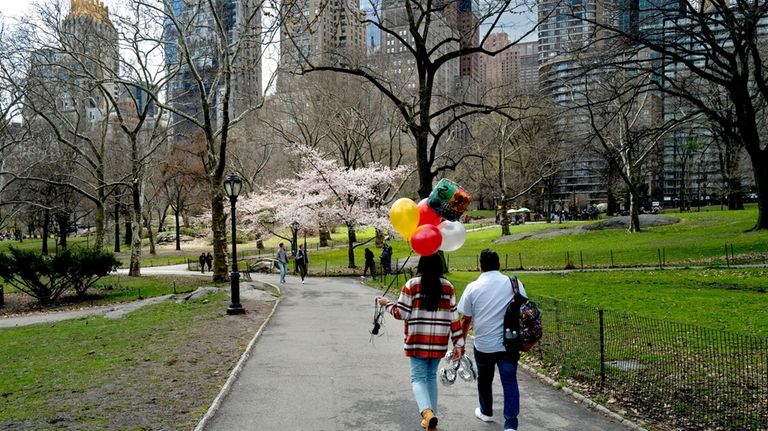 Central Park in Manhattan features walking and biking paths, playgrounds,...