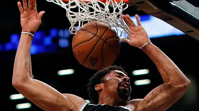 Nets guard Spencer Dinwiddie dunks the ball against the Jazz...