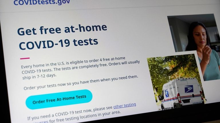 A United States government website, COVIDTests.gov, is displayed on a...