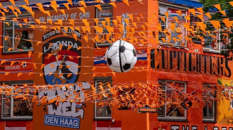 Inflatable soccer balls, orange tarp, orange bunting, and Dutch national...