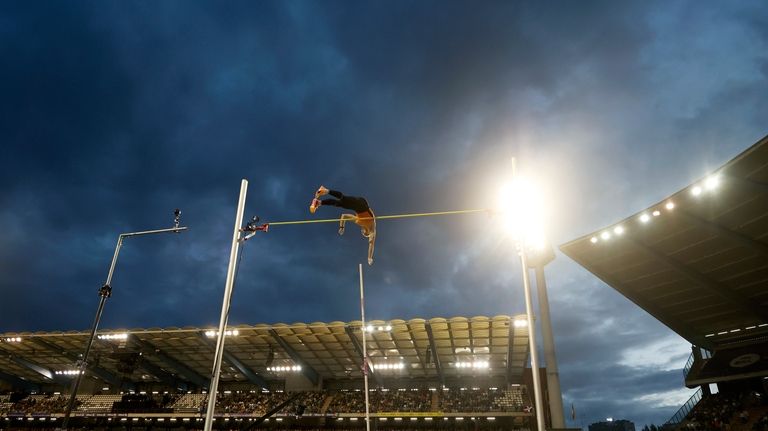 Armand Duplantis, of Sweden, makes an attempt in the men's...