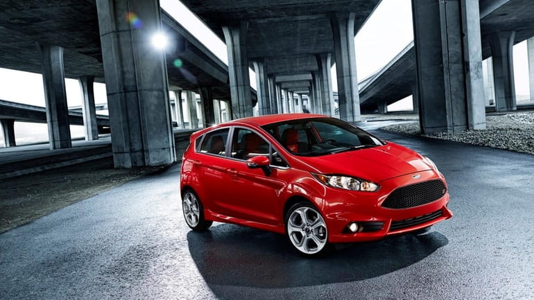 The 2014 Fiesta ST packs 197 horsepower and comes slathered...