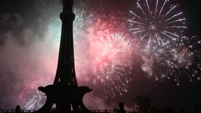 Fireworks light the sky close to the Minar-e-Pakistan or Pakistan...