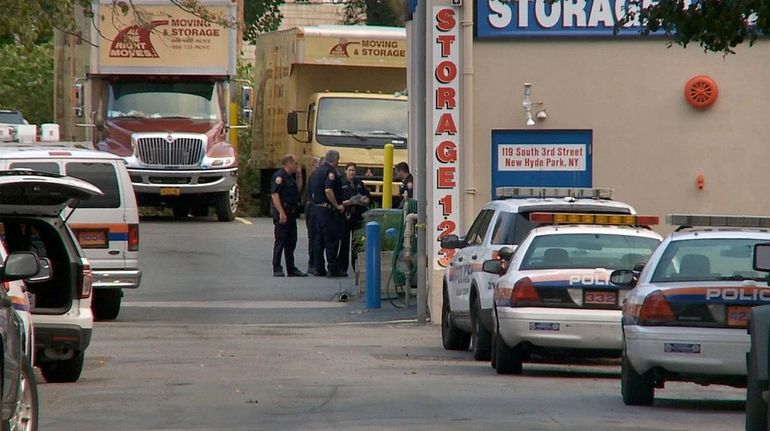 Nassau County police investigate a robbery at 123 Storage in...