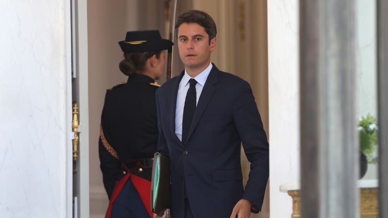 French Prime Minister Gabriel Attal leaves the weekly cabinet meeting,...