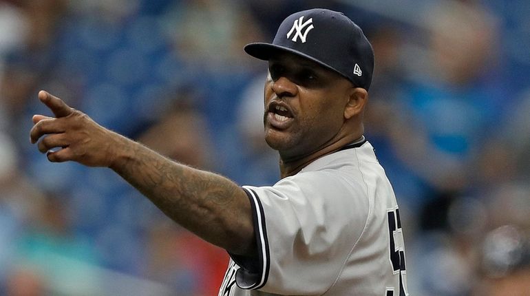 New York Yankees' CC Sabathia points at the Tampa Bay...