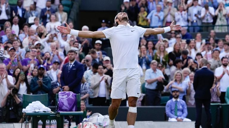 Lorenzo Musetti of Italy celebrates after defeating Taylor Fritz of...