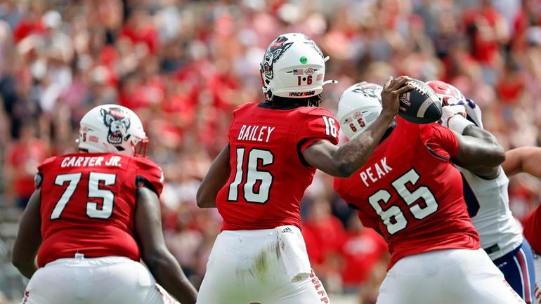 North Carolina State quarterback CJ Bailey (16) looks to throw...