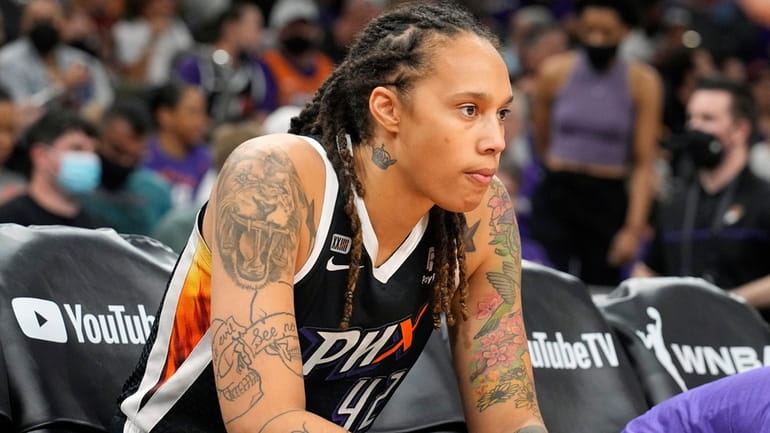 FILE - Phoenix Mercury center Brittney Griner sits during the...