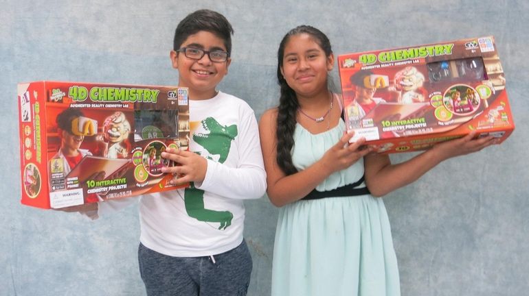 Kidsday reporters Yahir Lira-Garcia, left, and Jensea Diaz tested 4D Chemistry Augmented...