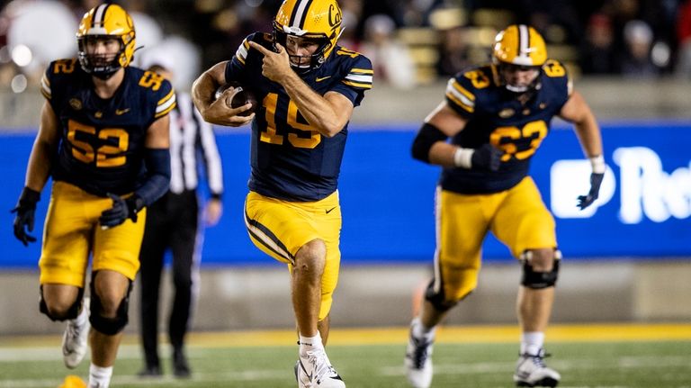 California quarterback Fernando Mendoza (15) rushes down the field during...