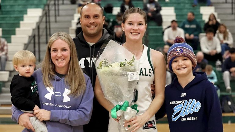 Floyd guard Kayla Gilmore poses for a picture with her...