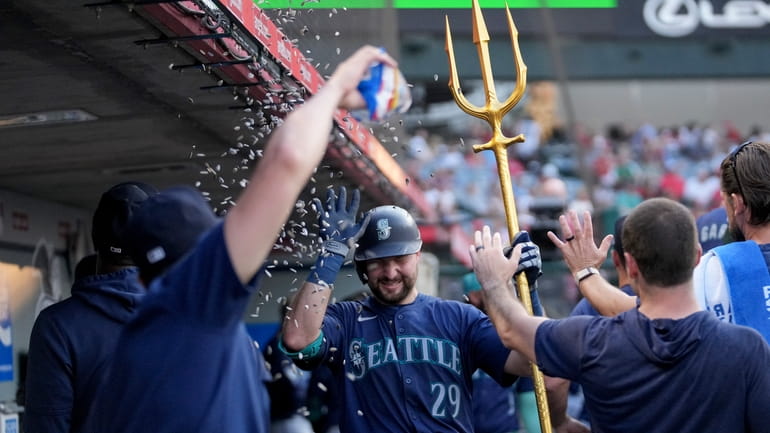Seattle Mariners' Cal Raleigh (29) celebrates after hitting a home...