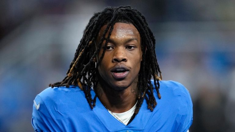 Detroit Lions wide receiver Jameson Williams watches during an NFL...