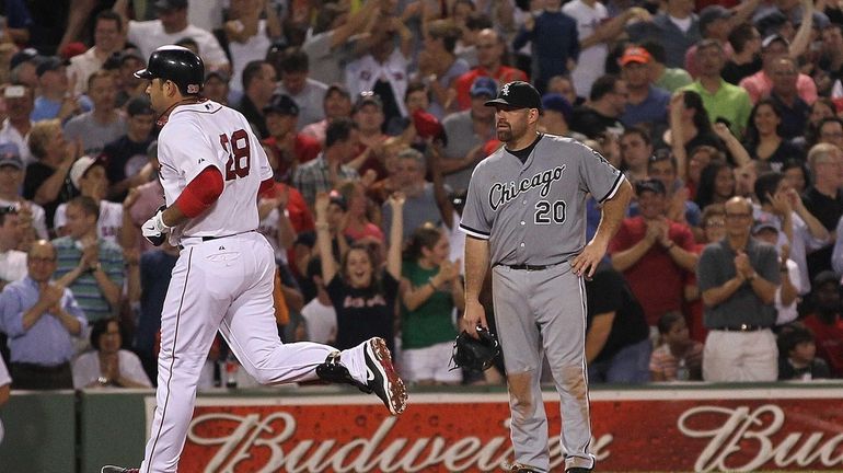 Kevin Youkilis #20 of the Chicago White Sox looks away...