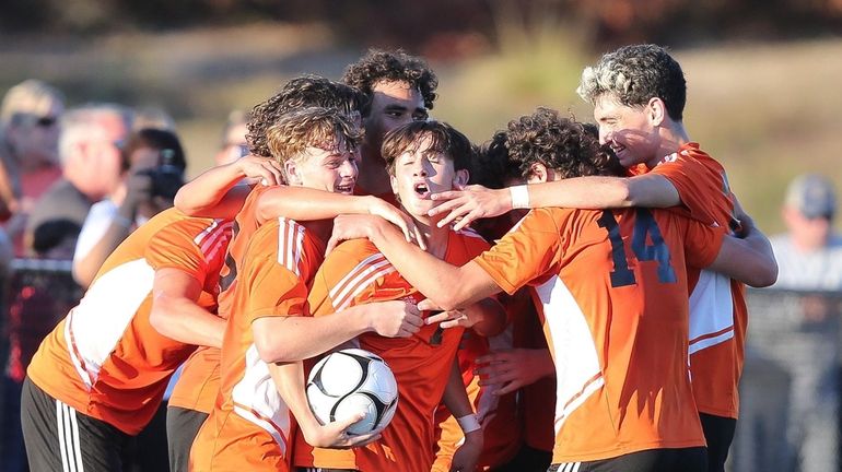 Babylon's players celebrate their win during the Suffolk boys soccer...