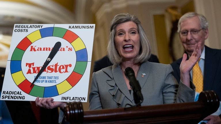 Sen. Joni Ernst, R-Iowa, speaks to the media following the...