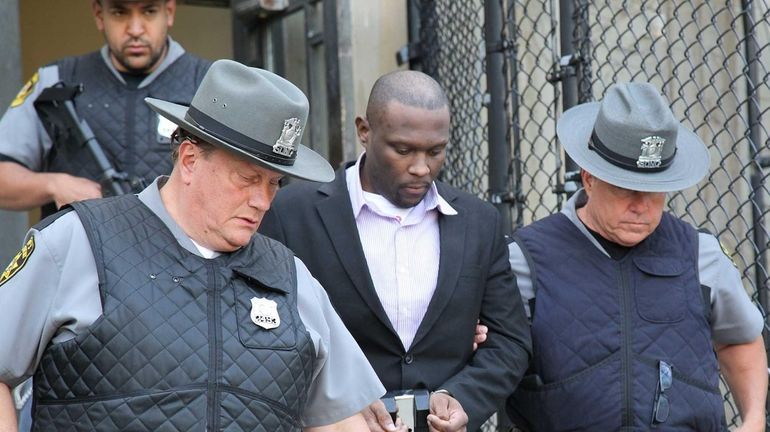 Accused cop killer Darrell Fuller leaves the Nassau County Courthouse...