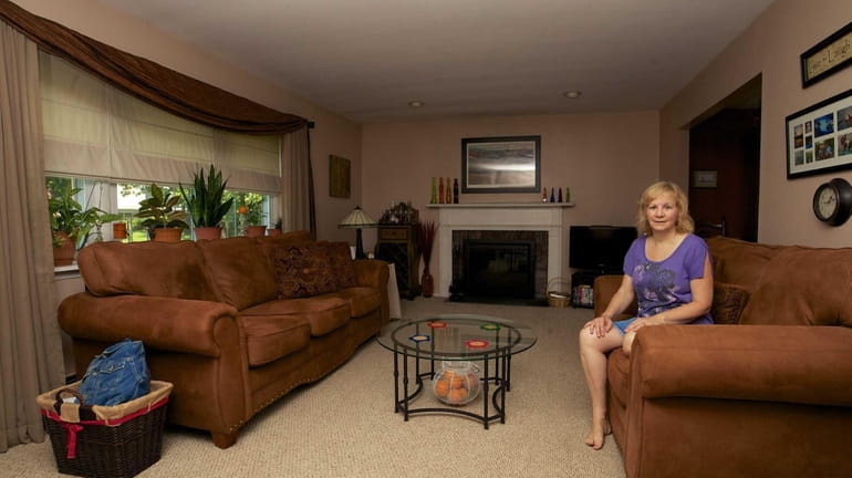 Donna O'Sullivan in the living room of her house in...