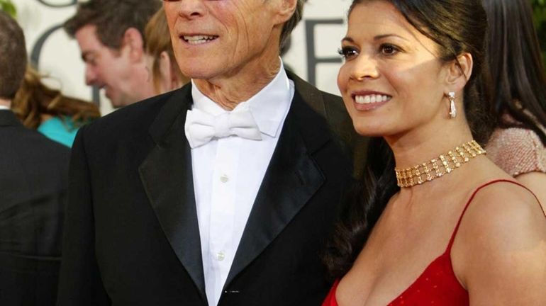 Clint Eastwood arrives with wife Dina Eastwood at the 61st...