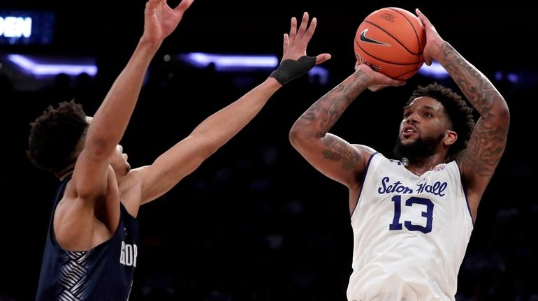 Seton Hall guard Myles Powell  shoots against Georgetown guard Jamorko...