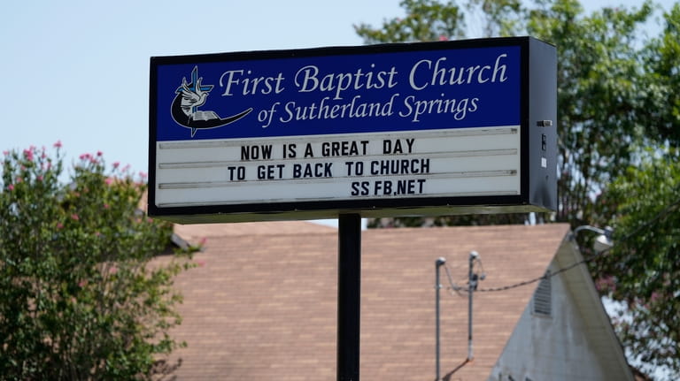 A sign is seen at the First Baptist Church in...