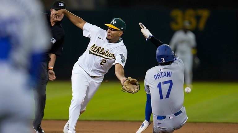 Oakland Athletics second baseman Darell Hernaiz (2) is unable to...