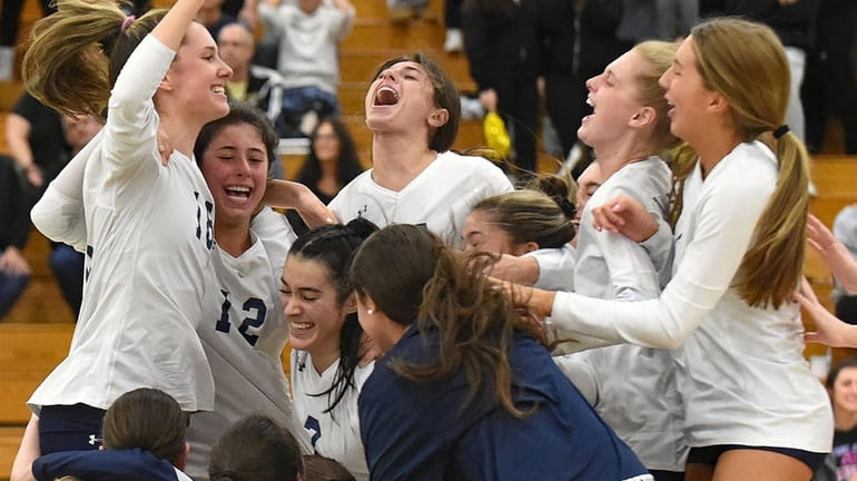 Massapequa teammates celebrate after their 3-0 win over Commack in...