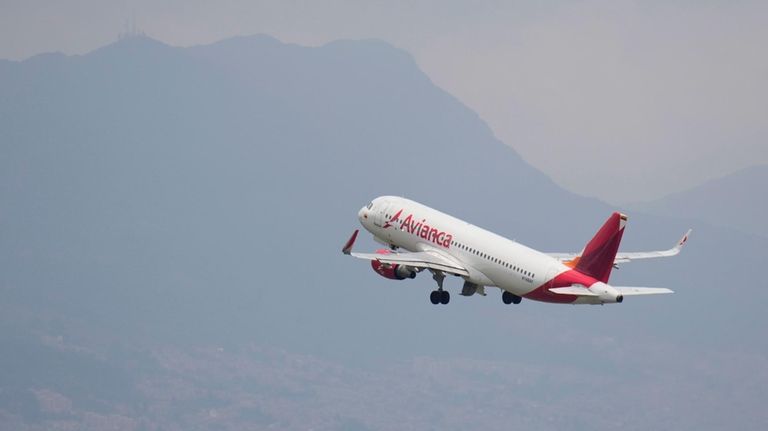 An Avianca plane climbs after take-off from the El Dorado...