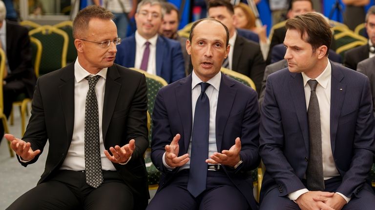 From right, Romanian Energy Minister Sebastian Burduja, Georgia's Minister of...