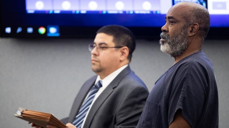 Defense attorney Robert Arroyo, left, stands by Duane "Keffe D"...