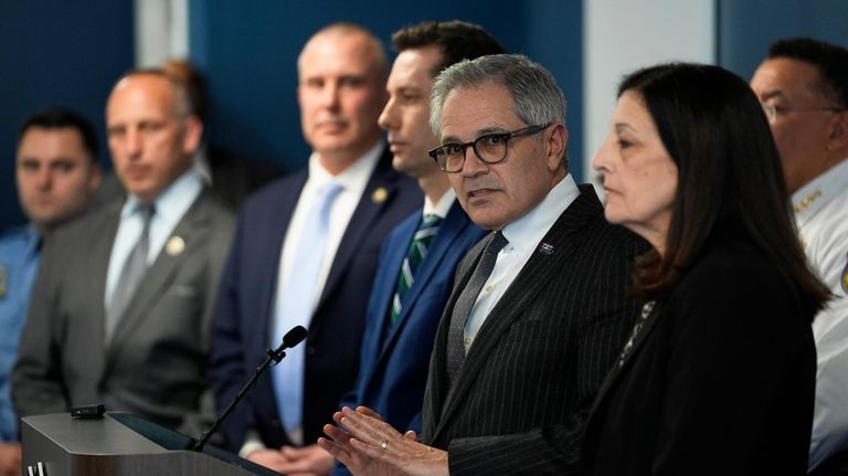 Philadelphia District Attorney Larry Krasner, second right, speaks during a...