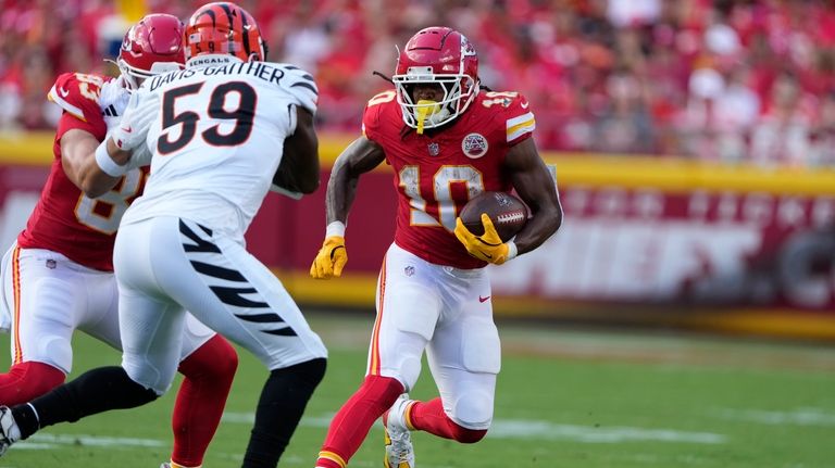 Kansas City Chiefs running back Isiah Pacheco (10) runs with...