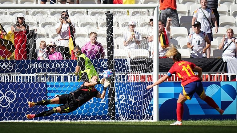 Germany's goalkeeper Ann-Katrin Berger stops a penalty by Spain's Alexia...