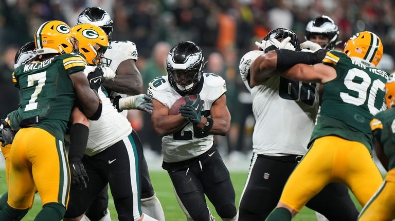 Philadelphia Eagles running back Saquon Barkley (26) runs for a...