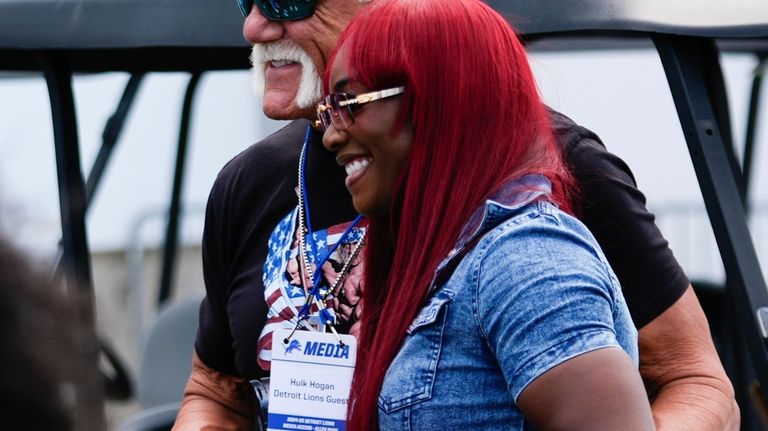 Former professional wrestler Hulk Hogan poses with boxer Claressa Shields...