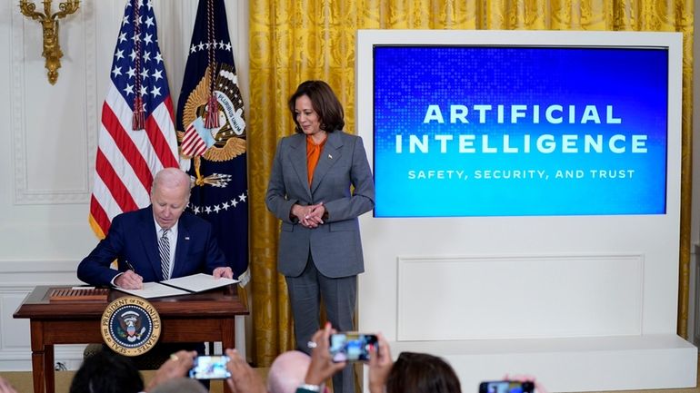 President Joe Biden signs an executive on artificial intelligence in...