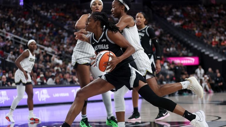 Las Vegas Aces guard Tiffany Hayes drives toward the hoop...