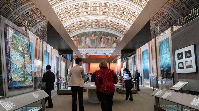 People visit the exhibit, "Collecting Memories: Treasures from the Library...