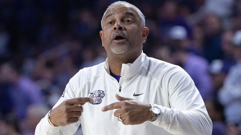 Kansas State coach Jerome Tang instructs his team during the...