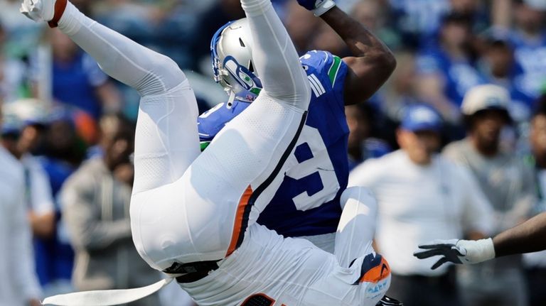 Seattle Seahawks running back Kenneth Walker III (9) carries the...