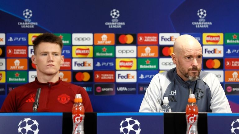 Manchester United's Scott McTominay, left, and manager Erik ten Hag...