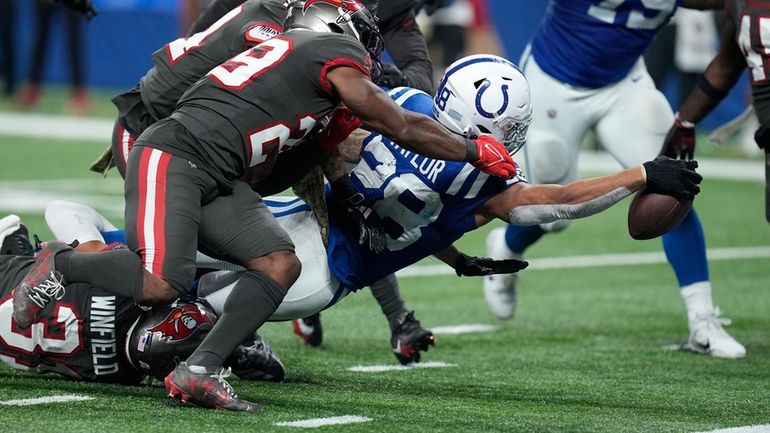 Indianapolis Colts running back Jonathan Taylor (28) reaches for a...