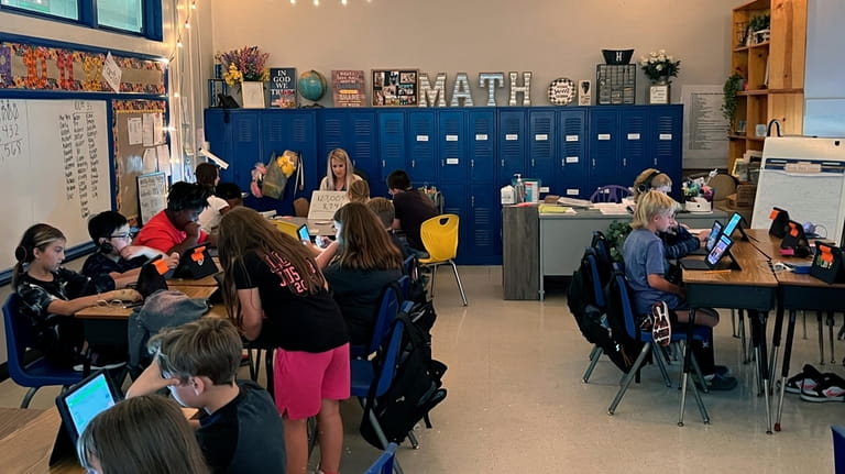 Piedmont Elementary School math teacher Cassie Holbrooks works with a...