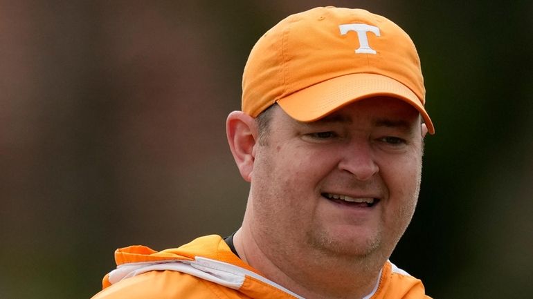 Tennessee NCAA college football coach Josh Heupel looks on during...