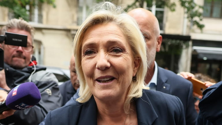 French far-right leader Marine Le Pen arrives at the National...