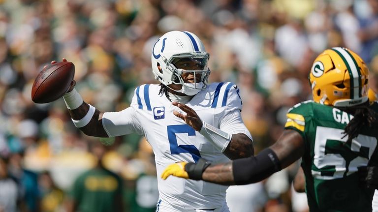 Indianapolis Colts quarterback Anthony Richardson (5) throws under pressure from...