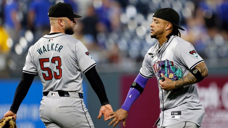 Arizona Diamondbacks' Christian Walker (53) and Ketel Marte celebrate at...