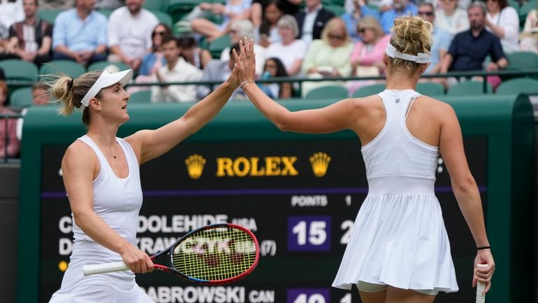 Gabriela Dabrowski of Canada, left, with playing partner Erin Routine...