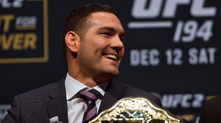 Seeming relaxed UFC middleweight champion Chris Weidman smiles during a...